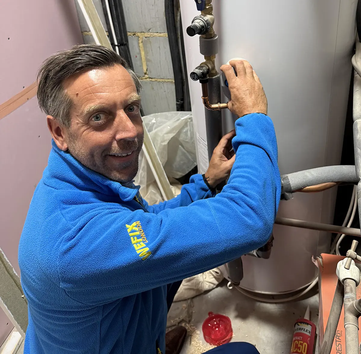 WeFix heating engineer working on cylinder pipework