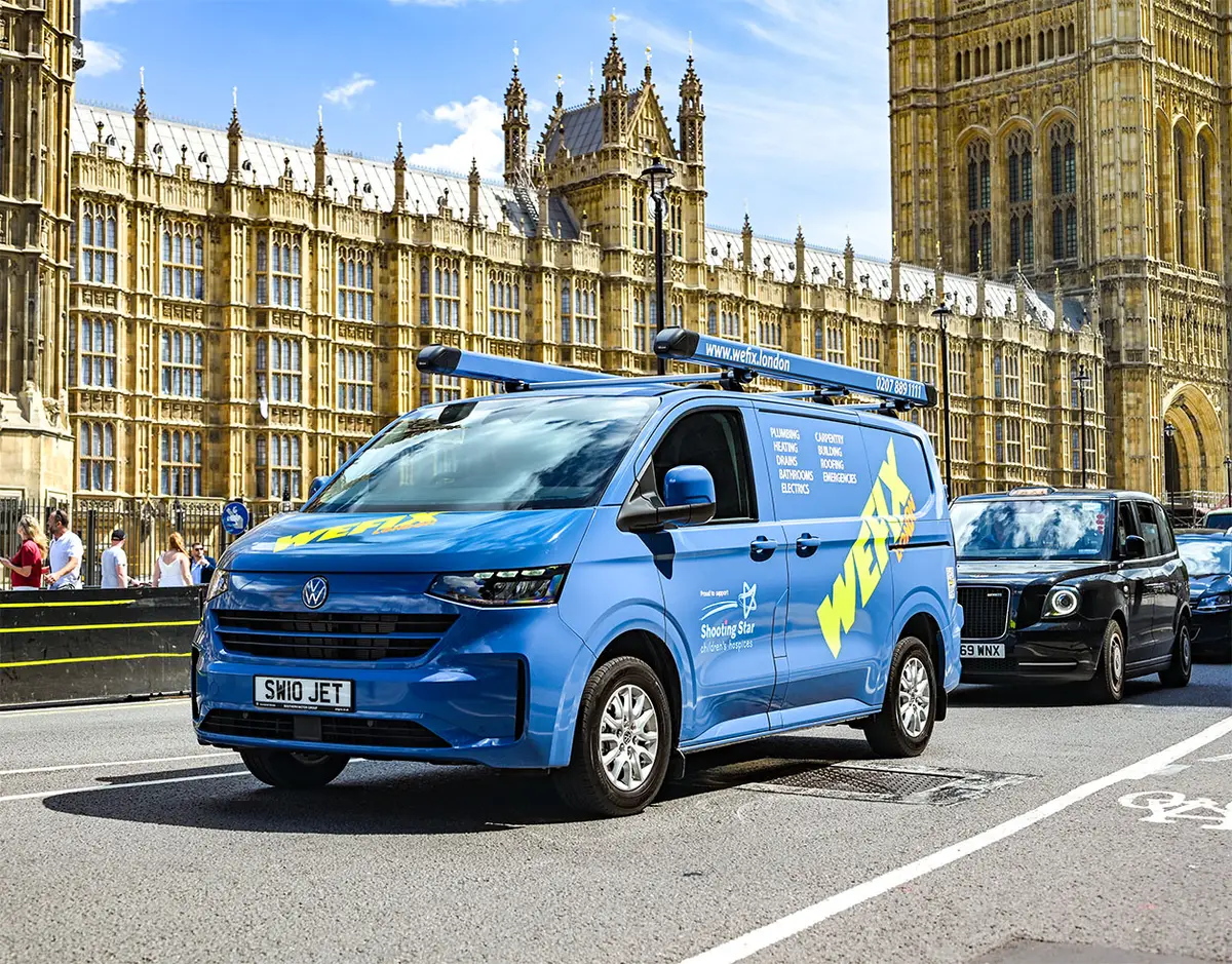 A liveried WeFix London van parked outside the Houses of Parliament in Westminster